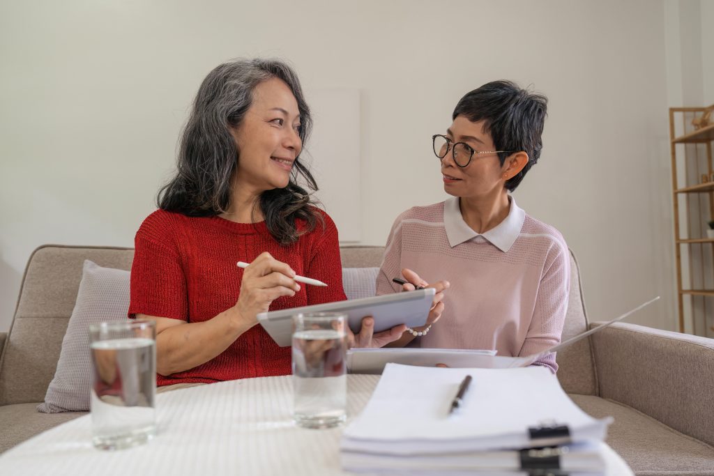 Two women in their 40s and 50s reviewing a retirement plan together
